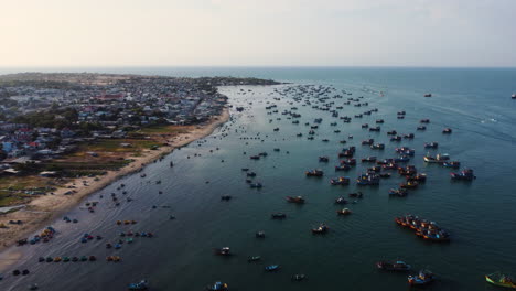 Aerial-panorama,-over-crowded-fishing-village-in-Southeast-Asia