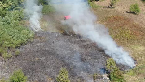 Controlled-fire-on-meadow.-Drone-day-footage