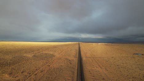 Aerial-of-grasslands-in-Northern-Arizona-with-long-road-into-infinity