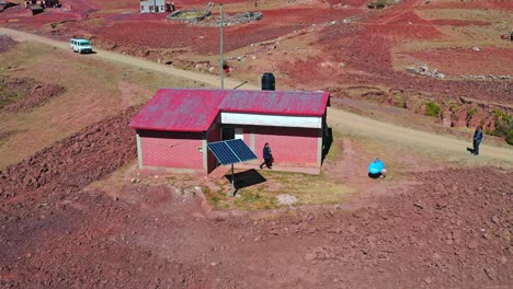 Drone-shot-of-an-individual-solar-energy-panel-on-a-rural-farm-in-the-Bolivian-Andres-Mountains