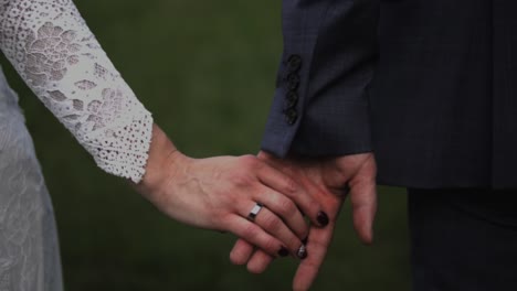 Wedding-couple-holding-hands-in-slow-motion