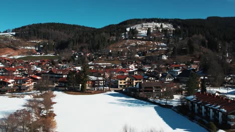 Winter-drone-shot-of-Chiemsee-village,-Bavaria,-Germany