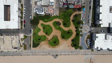 Aerial-view-above-the-Noble-Park,-in-sunny-Hermosa,-Los-Angeles,-USA---top-down,-drone-shot