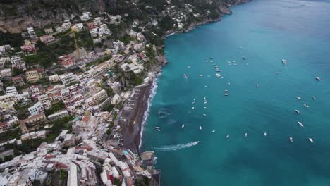 Epic-Birds-Eye-View-of-Positano-Coastal-Town-Beach-and-Turquoise-Blue-Ocean-on-the-Amalfi-Coast-in-Italy---Aerial