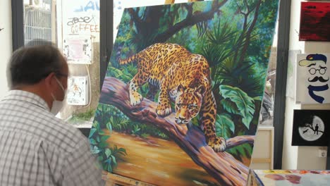 Artist-timelapse-painting-jaguar-in-art-gallery