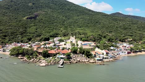 Aerial-drone-view-of-Portuguese-colonial-historic-neighborhood-with-old-Brazilian-church-of-Portuguese-architecture-in-Ribeirão-da-Ilha-Florianópolis
