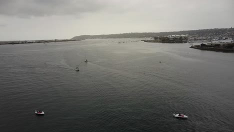 Aerial-view-of-sailing-boats-and-motorboats-in-the-overcast-North-San-Diego-Bay