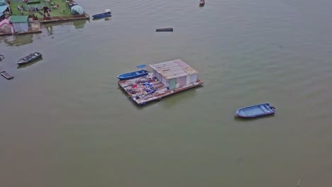 A-dynamic-aerial-footage-of-a-floating-dock-near-the-fishing-village-in-Lau-Fau-Shan-in-the-New-Territories-of-Hong-Kong