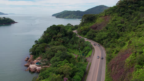 Beautiful-landscape-on-coast-of-Ubatuba,-traffic-on-coastal-road,-Brazil