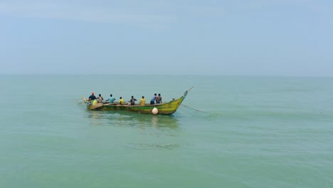 _Aerial-shot-of-a-boat-or-canoe-fishing-in-a-sea-during-the-day_25