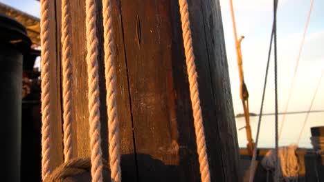 Old-Cog-Ship-Ropes-and-Wooden-Hoist-lit-by-an-Evening-Sun