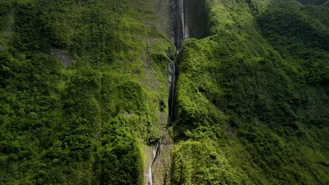 Aerial-view-of-a-waterfall-on-the-side-of-a-mountain-on-the-Reunion-Island