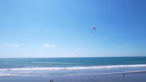 Aerial-drone-images,-Beach-Jaco,-Puntarenas,-Costa-Rica,-Jib-Up,-Water-Parachute