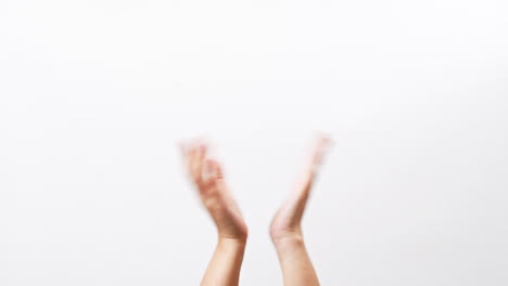 Close-up-of-Woman's-hand-clapping-celebrating-applause-doing-the-hand-gesture-isolated-on-a-white-studio-background-with-copy-space-for-place-a-text-message-for-advertisement-promote-a-product