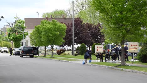 Police-officers-FBI-canvassing-ground-after-the-tragedy-of-the-mass-race-shooting-in-Buffalo,-New-York,-USA---May-17,-2022