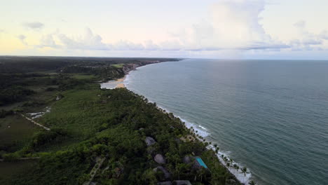 AERIAL---Beautiful-Tancoso-beach-in-Brazil,-spinning-shot