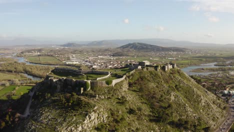 aerial-panoramic-over-imposing-Rozafa-Castle,-aka-Shkoder-Castle,-in-northwestern-Albania