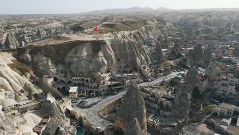 Aerial-shot-of-Cappadocia-hotels-carved-from-stone-rock,-cave-style