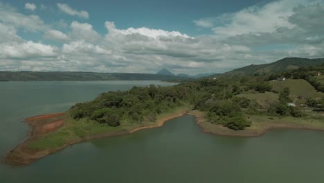 Aerial-view-of-tropical-lake-in-Arenal-Volcano-surroundings,-Costa-Rica