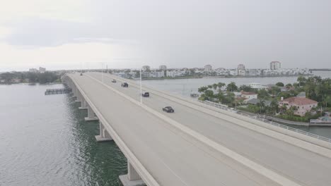 Delgado-Memorial-Bridge,-St-Pete-Beach-waterfront-city-aerial-view,-Florida,-USA
