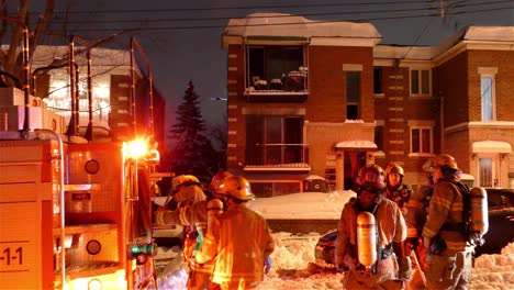 Canadian-firefighters-take-out-ladder-during-an-an-emergency,-Montreal,-Canada
