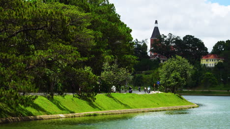 Static-view-of-luxuriant-side-bank-of-Da-Lat-lake-with-street-cross-by