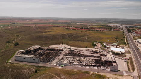 Aerial-View-Of-Aftermath-Of-Burnt-Industrial-Warehouse-In-Seseña,-Toledo,-Spain