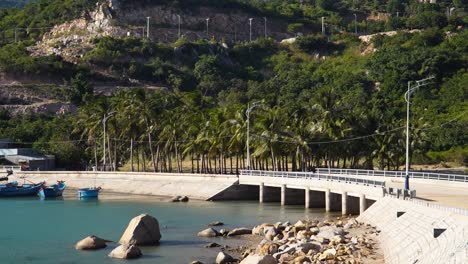 Idyllic-coastal-highway-and-bridge-in-Vinh-Hy-Bay,-Vietnam