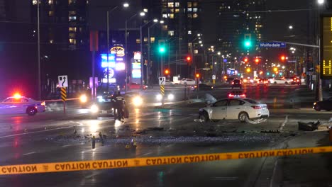 Police-Cars-and-policemen-Near-A-White-Crashed-Car-In-A-Street-In-Mississauga,-Canada