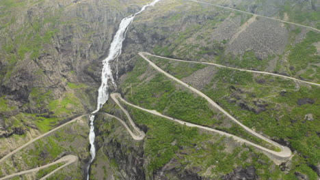Famous-Hairpin-Bend-Of-Trollstigen-Mountain-Pass-And-Waterscape-Of-Stigfossen-Waterfall-In-Norway