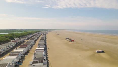 Aerial-view-flying-over-rows-of-beach-houses