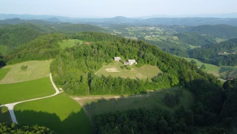 Cinematic-view-of-the-drone-flying-over-the-green-hill