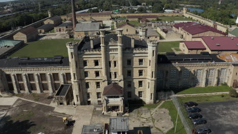 Aerial-dolly-shot-of-the-Joliet-Prison,-an-iconic-historical-landmark-now-abandoned-and-derelict,-Chicago,-Illinois,-United-States