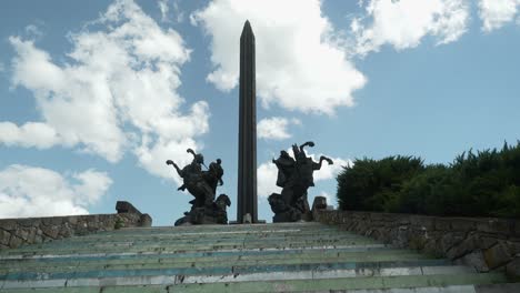 Looking-up-flight-of-steps-to-majestic-King-asens-dynasy-monument-with-silhouetted-horses-statues