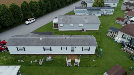Drone-View-of-a-Mobile,-Manufactured-or-Prefab-Home-Being-Removed-from-a-Park