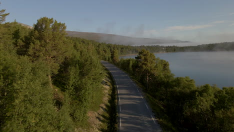 aerial-shot-of-highway-near-Sjodals-Lake,-Jotunheimen,-National-Park,-Norway