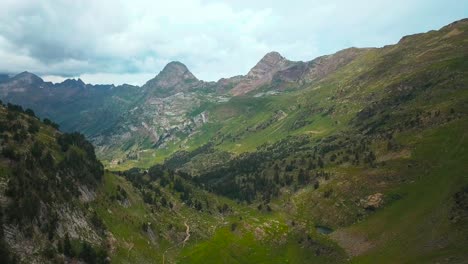 Aerial-horizontal-4K-footage-of-huge-mountains-in-a-green-natural-environment-in-the-Spanish-Pyrenees