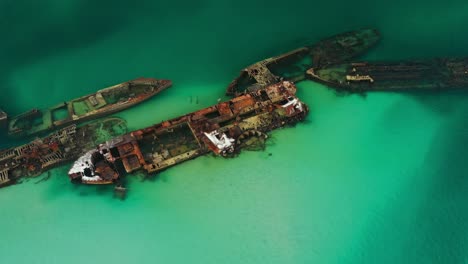 High-drone-footage,-Moreton-Island-shipwrecks,-Beautiful-clear-water,-Queensland-Australia