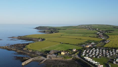 An-aerial-slide-footage-of-a-campsite-near-Old-Head-Kinsale,-county-Cork-in-Ireland