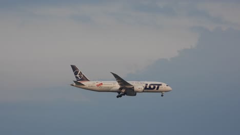 Tracking-shot-Polish-Airlines-Aircraft-Passing-clouds,-descending-to-Toronto-International-Airport