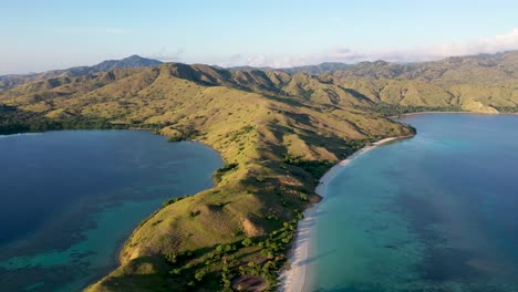 Loho-Gebah-Bay-and-peninsula-in-north-Komodo-Island-Indonesia,-Aerial-pan-right-shot