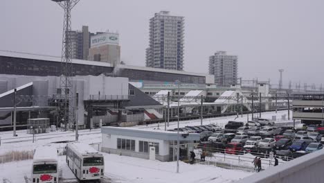 Morioka-Train-Station-in-Winter,-Snow-Falling-over-Northern-Japan