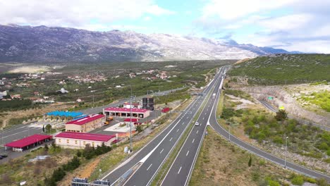 Toll-Maslenica---Toll-Booth-And-A1-Motorway-Overlooking-Mountains-At-Daytime-In-Jasenice,-Zadar,-Croatia
