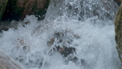 River-water-flow-close-up-at-slow-motion