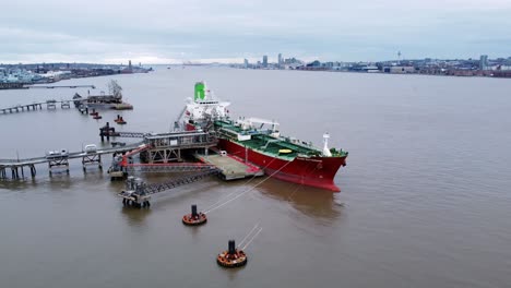 Silver-Rotterdam-chemical-oil-tanker-ship-loading-at-Tranmere-terminal-Liverpool-aerial-view