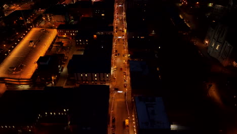 Street-Of-Sherbrooke-City-Illuminated-With-Lights-At-Nighttime-In-Canada---aerial-pullback
