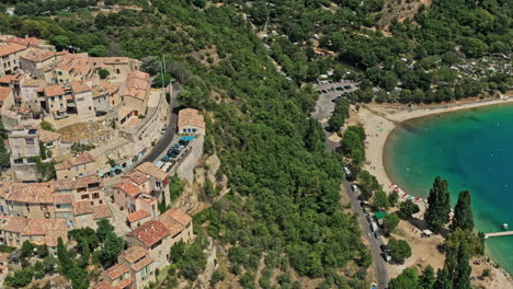 Sainte-Croix-du-Verdon-France-Aerial-v1-birds-eye-view-drone-fly-around-hillside-village-capturing-mid-century-architectures-and-building-surrounded-beautiful-landscape---July-2021
