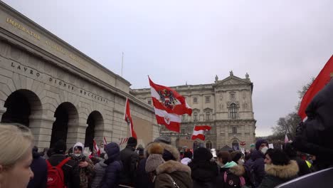 Many-people-gathered-in-Vienna,-Austria-during-anti-vax-protests---Slow-Motion