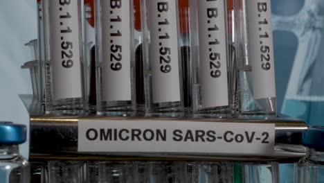 Close-up-tilt-shot-of-a-row-of-test-tubes-labelled-with-the-new-Covid-19-variant-Omicron,-the-new-mutation-identified-in-South-Africa-B