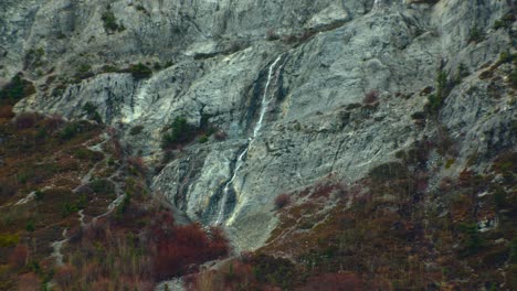 Waterfall-small-on-mountain-side-in-autumn